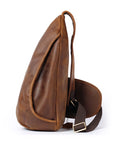 Brown leather sling bag on a white background