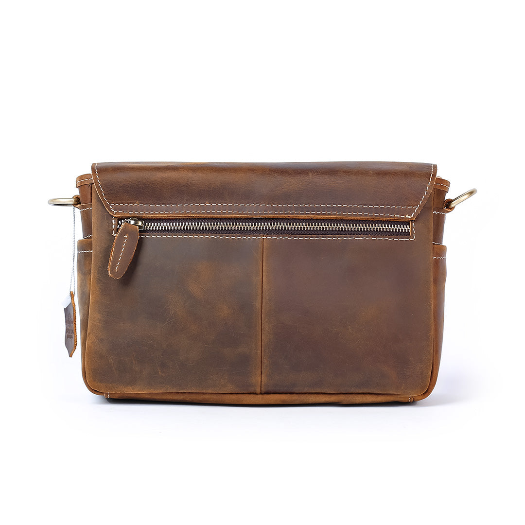 Brown leather bag on a white background