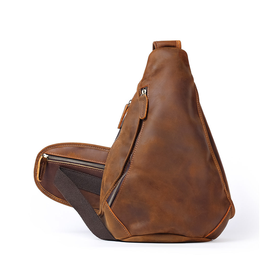 Brown leather sling bag on a white background
