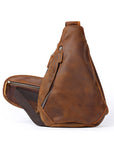 Brown leather sling bag on a white background