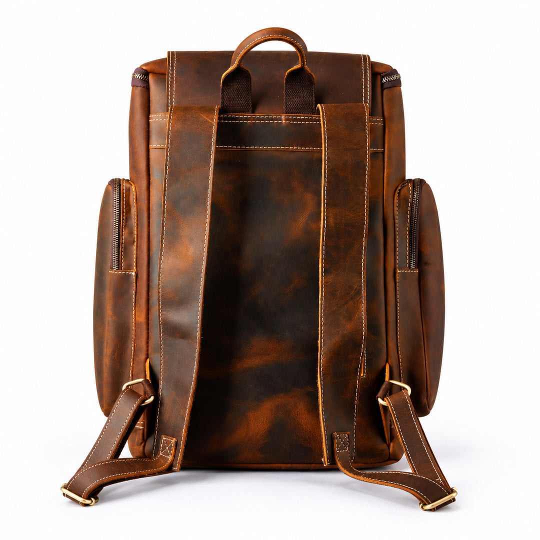 A brown leather backpack shown from the back, featuring a distressed finish, contrast stitching, top carry handle, side pockets, and adjustable shoulder straps.