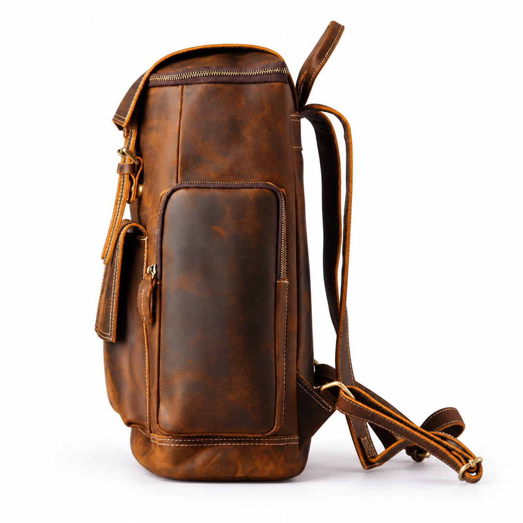 A brown distressed leather backpack shown from a three-quarter angle on a white background, featuring a main zippered compartment, a front slip pocket, and a detachable shoulder strap.