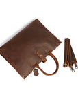 Top view of a brown men's vintage leather bag with detachable shoulder strap and minimalist design.