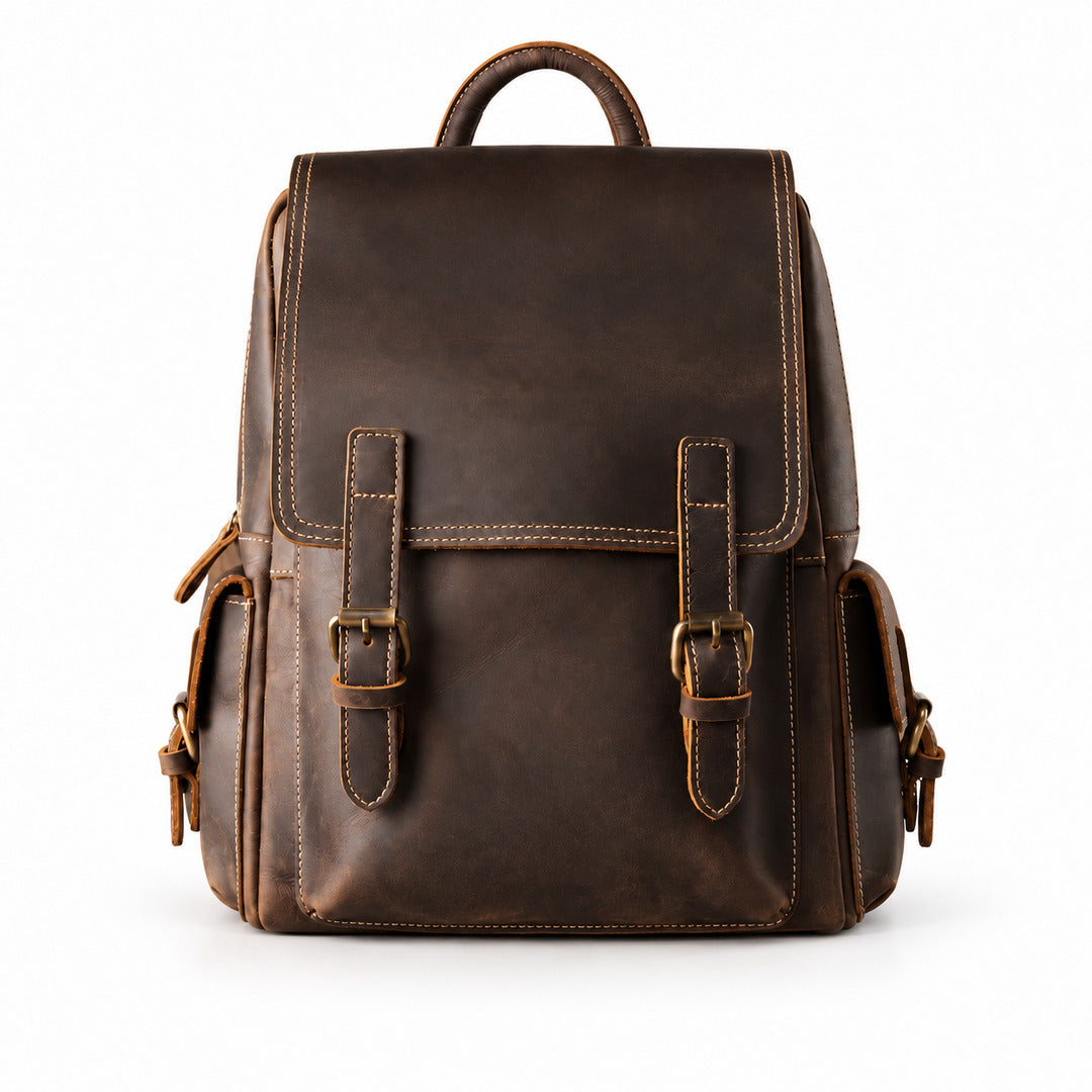 A dark brown distressed leather backpack with two front buckle straps, a top handle, and side pockets.