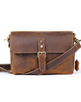 Brown leather satchel bag on a white background