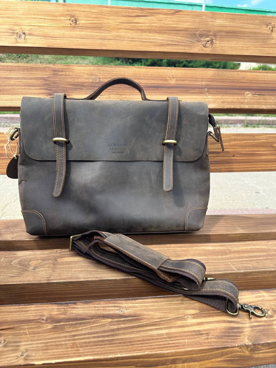 Classic brown leather messenger bag for men with comfortable shoulder strap and rugged look.
