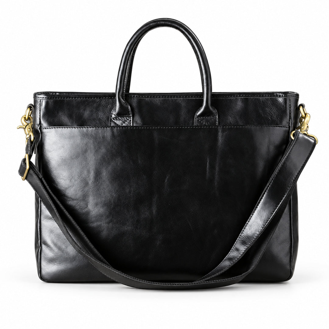 Classic black full-grain leather briefcase back with a wide slip pocket and shoulder strap