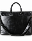 Classic black full-grain leather briefcase back with a wide slip pocket and shoulder strap