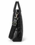 Classic black full-grain leather briefcase side profile with a narrow gusset and detachable strap