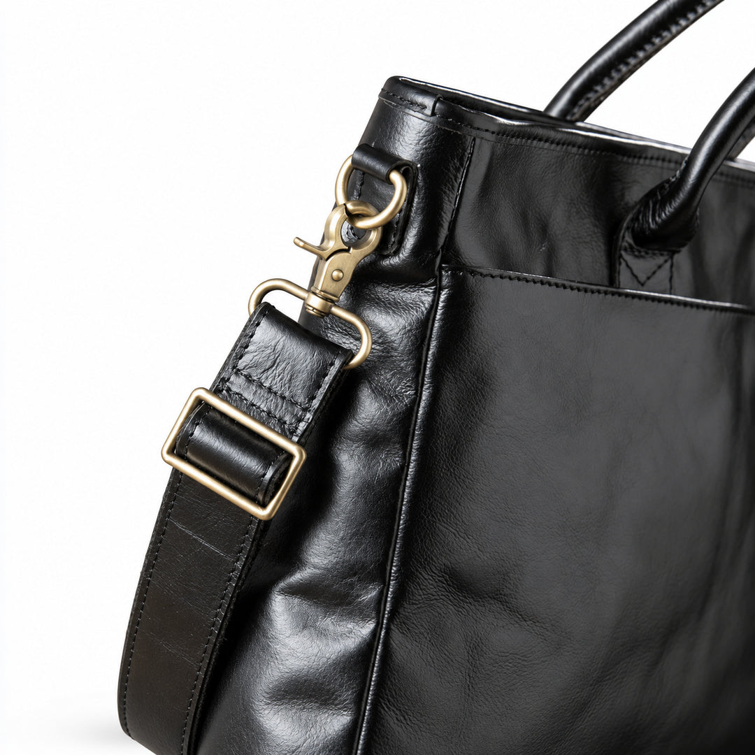 Classic black full-grain leather briefcase shoulder strap with a swivel clasp and metal adjuster