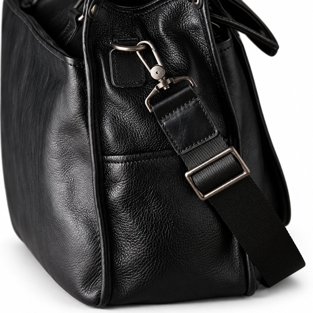 Classic black full-grain leather tote shoulder strap with a swivel clasp and rectangular metal adjuster