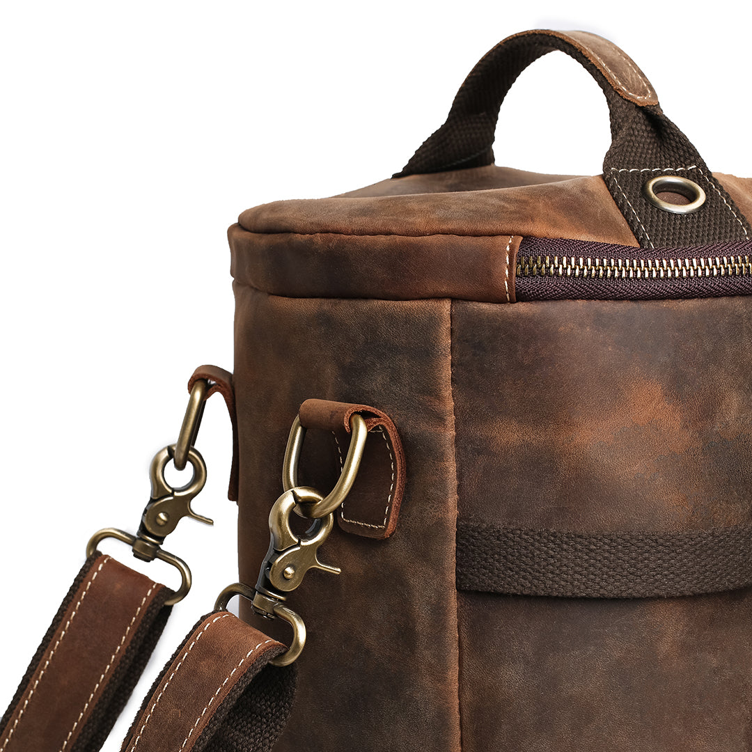 Close-up of a comfortable leather handle on a vintage backpack, handcrafted from Crazy Horse leather.