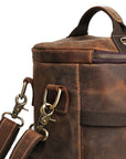 Close-up of a comfortable leather handle on a vintage backpack, handcrafted from Crazy Horse leather.