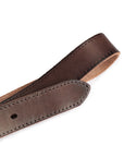 Detailed view of the belt tip showing its high-quality leather finish and craftsmanship.