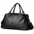 Elegant black full-grain leather duffel bag with twin handles and a stitched center seam.