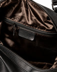 Elegant black full-grain leather duffel bag interior zip pocket with brown fabric lining.