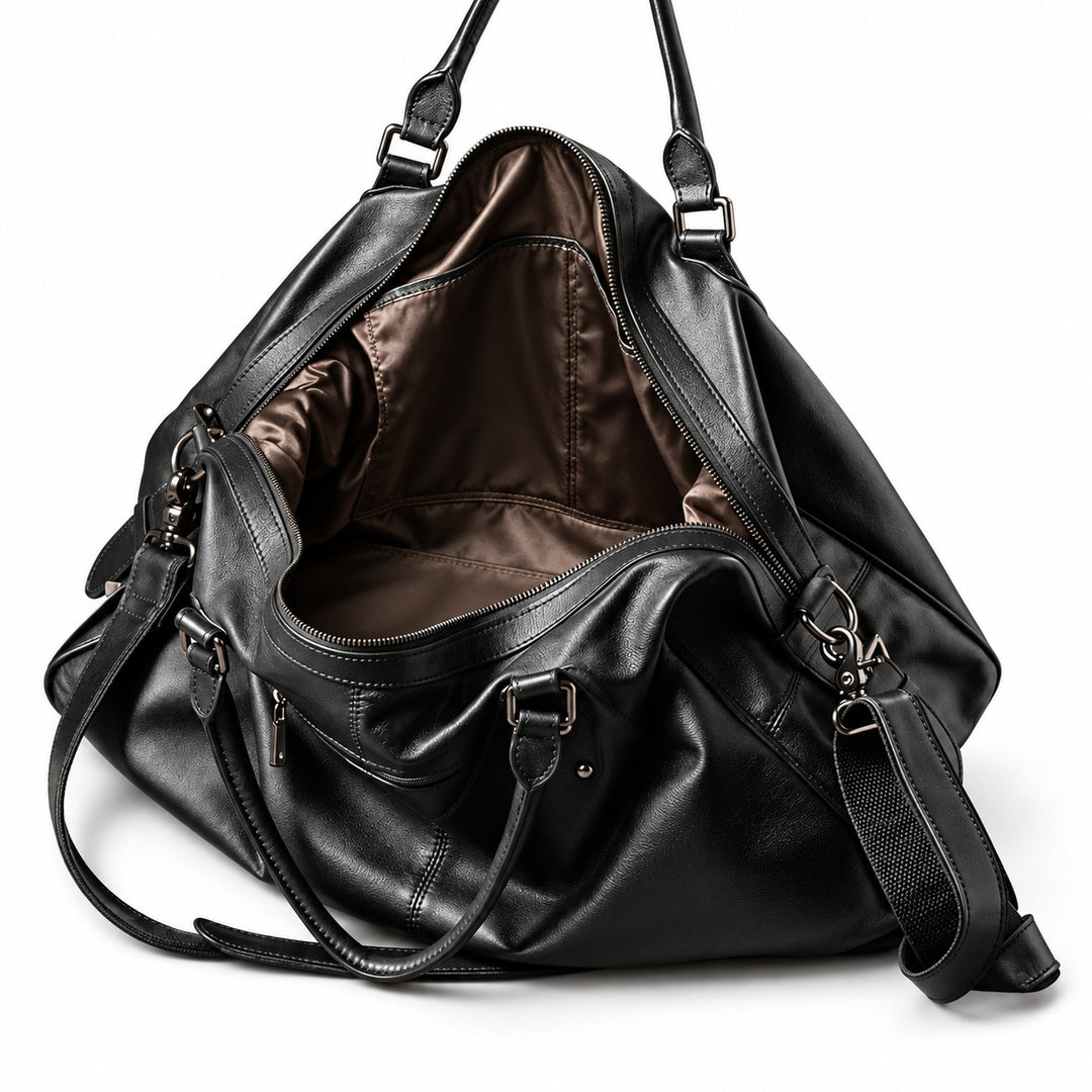 Elegant black full-grain leather duffel bag with an open main compartment and brown lining.