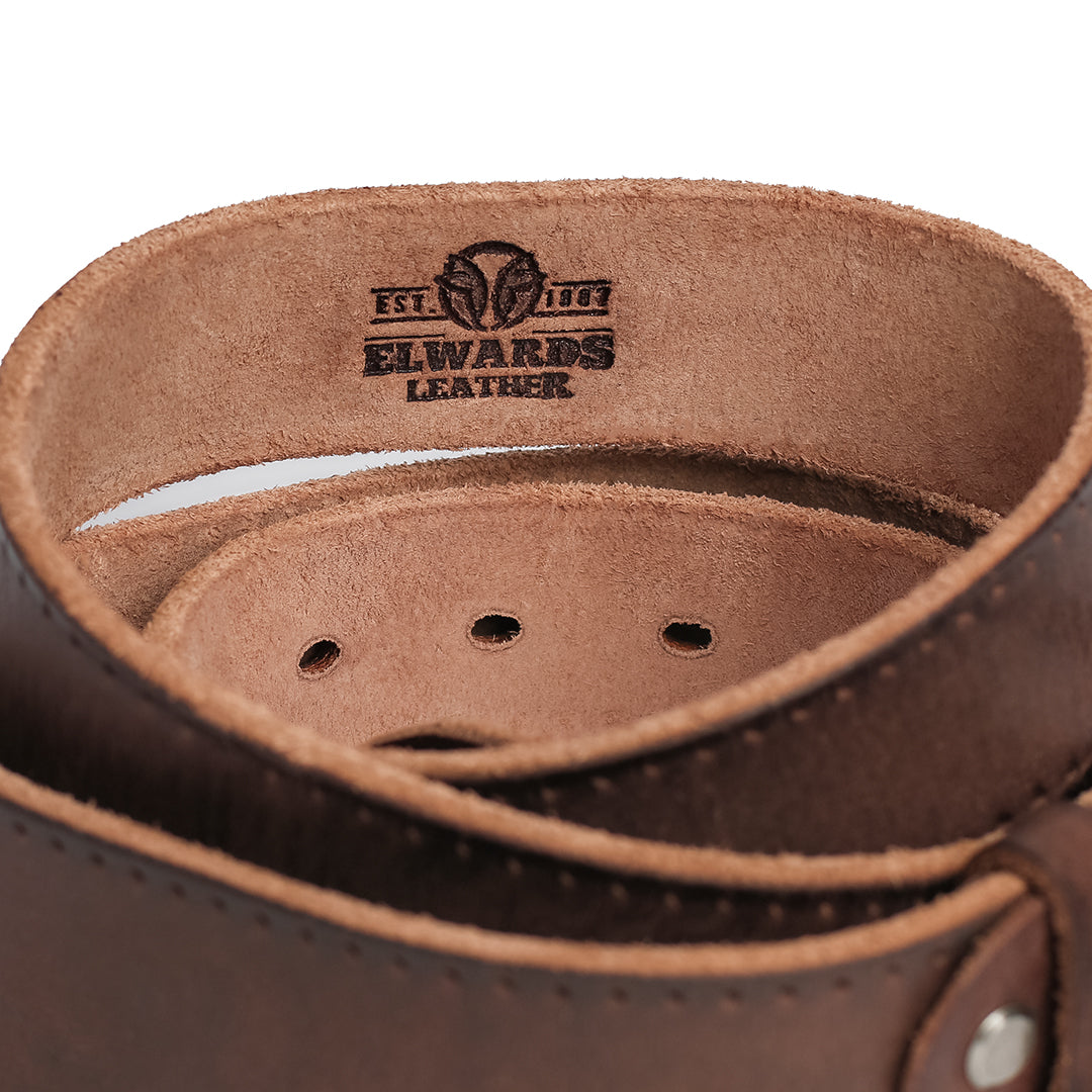 Close-up of the inner engraving on the leather belt strap, featuring the Elwards Leather logo and vintage detailing.