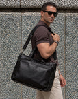 Executive black leather briefcase for men with top handles and adjustable shoulder strap for business and work