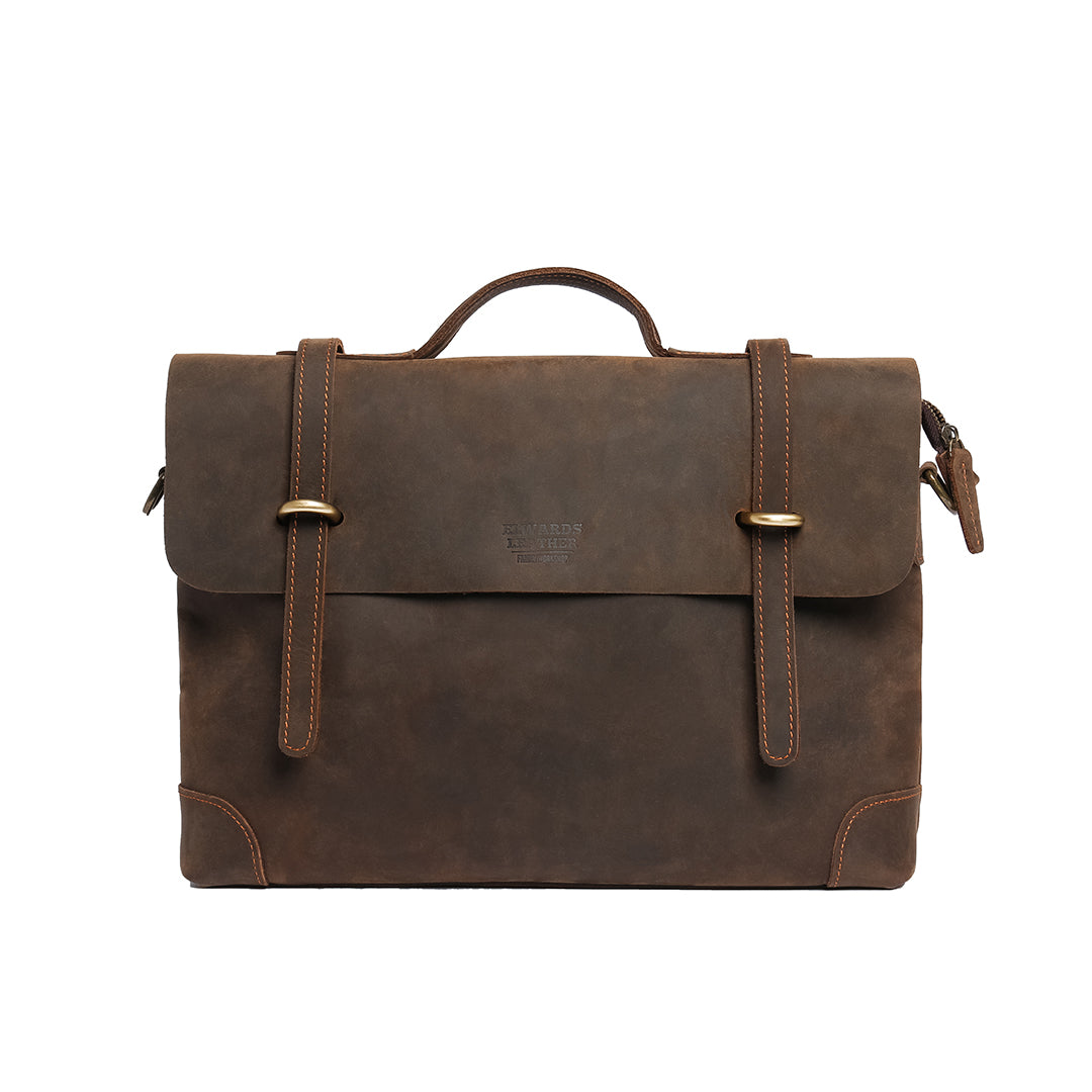 Front view of a vintage-style leather briefcase, handcrafted with buckle straps and premium detailing.