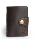 Front view of a premium leather card holder with embossed logo and vintage brass button closure.