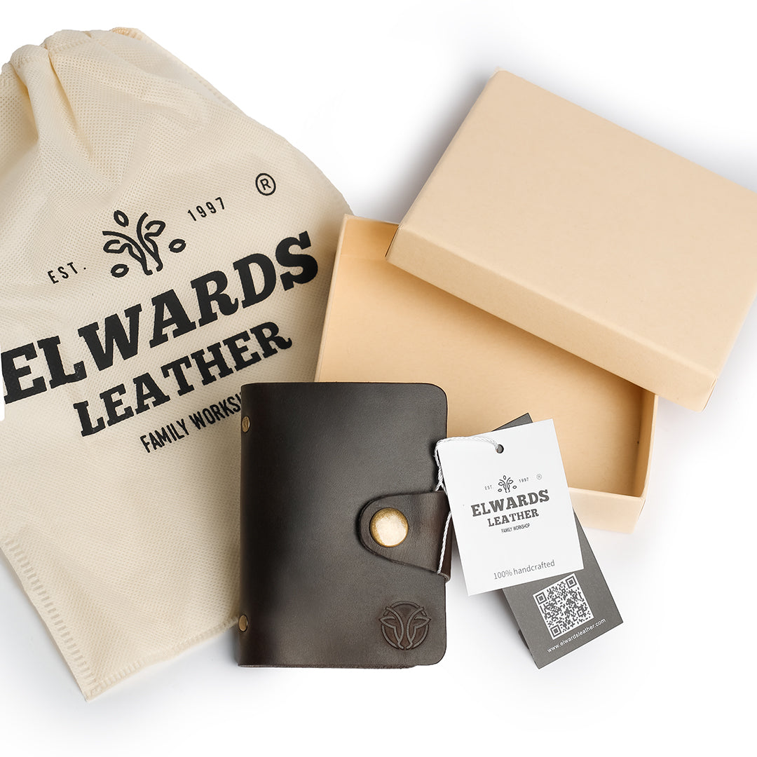 Gift packaging for leather card holder, including branded Elwards Leather pouch and box, perfect for special occasions.