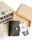 Gift packaging for leather card holder, including branded Elwards Leather pouch and box, perfect for special occasions.