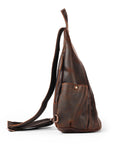 Brown leather sling bag on a white background