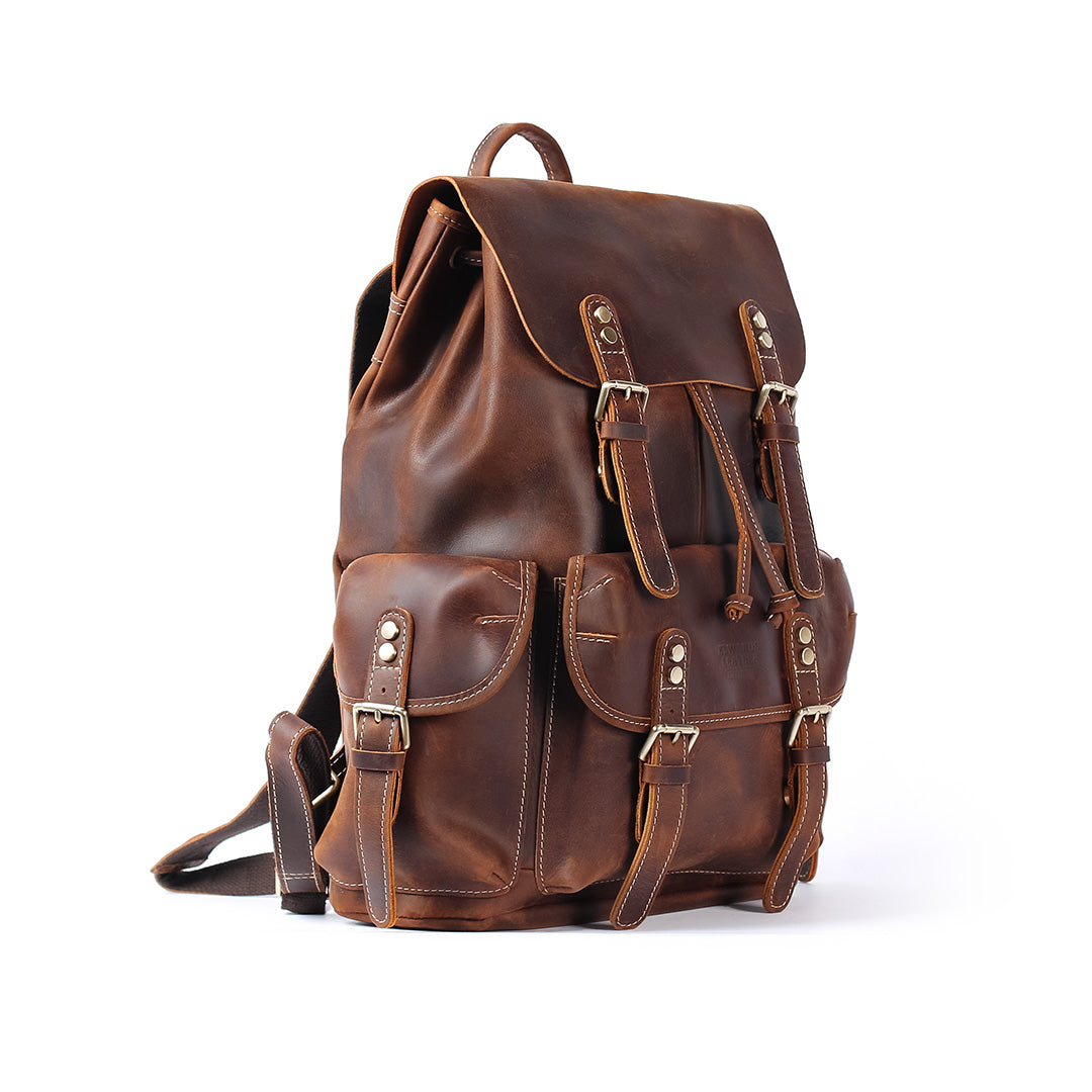 Brown leather backpack on a white background