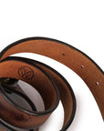 Brown leather belt with a visible brand logo on a white background