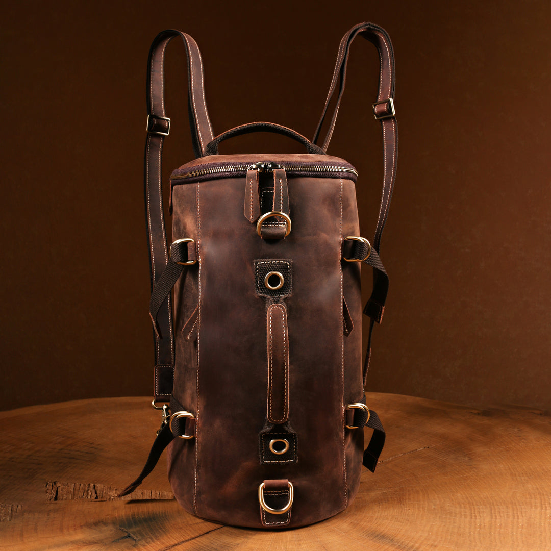 Front view of a handmade vintage leather backpack with adjustable straps, ideal for travelers and daily commuters