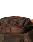 Interior view of a brown Crazy Horse leather duffle bag with reinforced lining and multiple compartments.