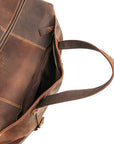 Interior of vintage crazy horse leather bag with open compartments, ideal for travel essentials and everyday use.