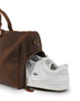 Close-up of the dedicated shoe compartment in a premium Crazy Horse leather duffle bag, perfect for organized travel.