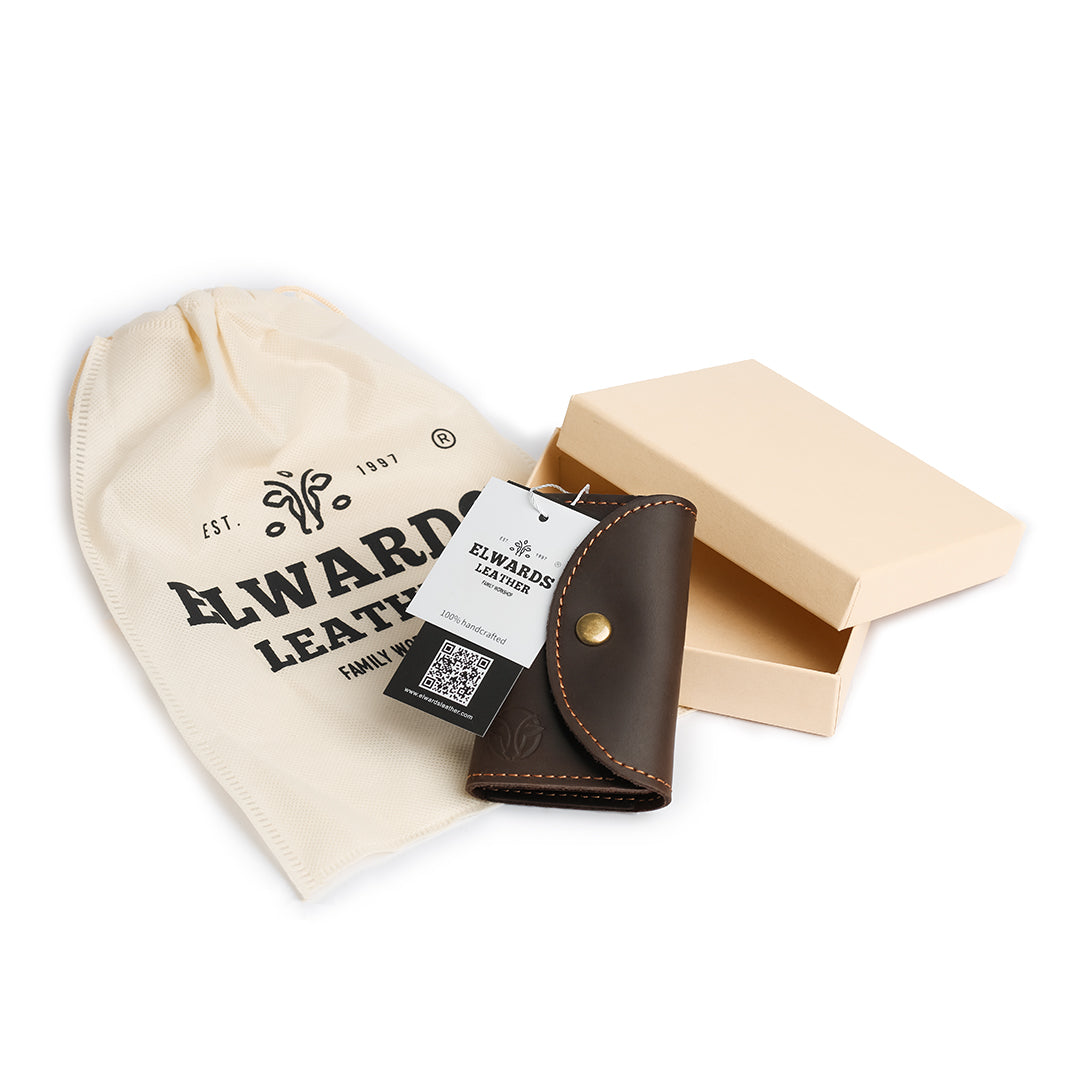 Gift-ready packaging of a vintage-style handmade leather key case, presented in a branded pouch and elegant box.