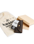 Gift-ready packaging of a vintage-style handmade leather key case, presented in a branded pouch and elegant box.