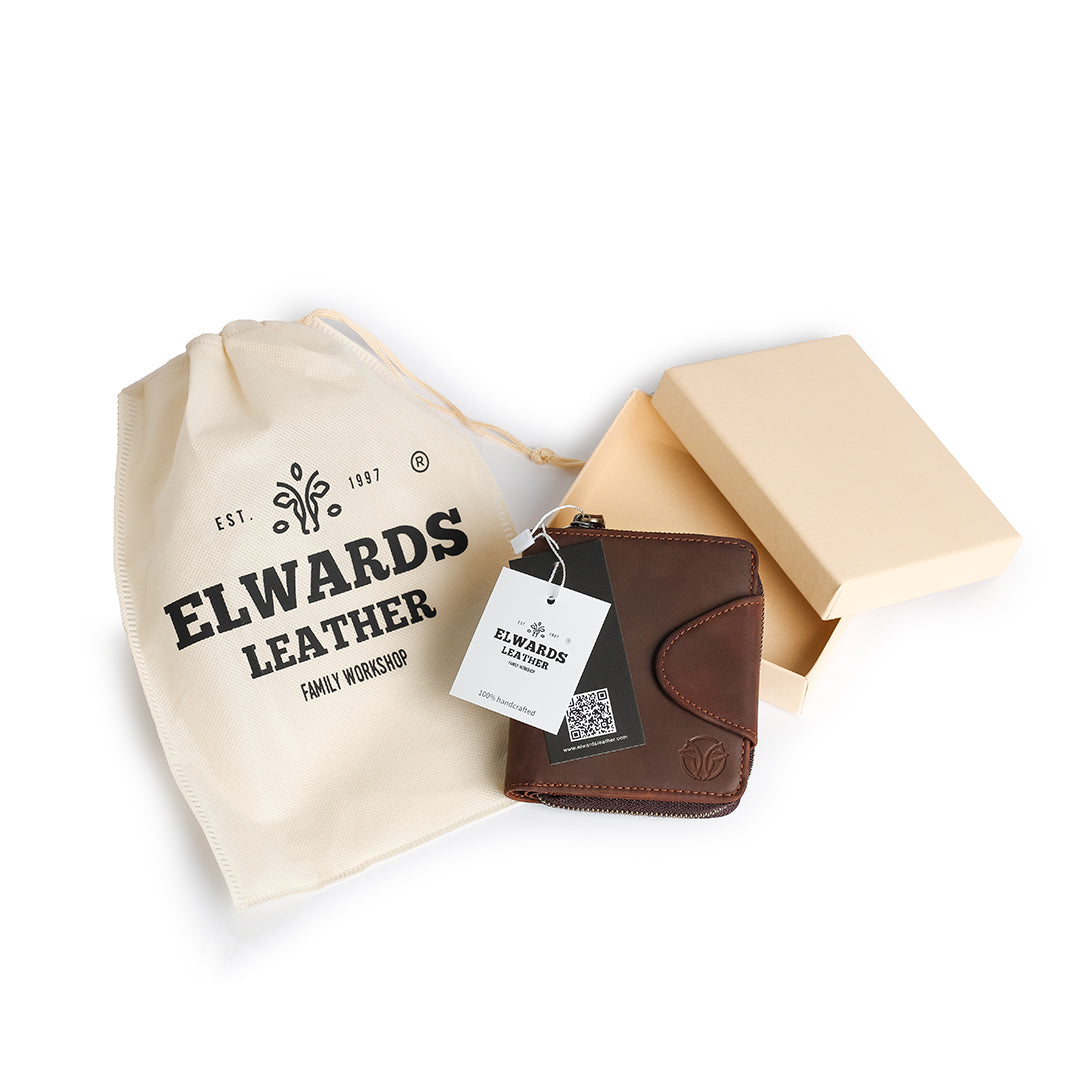 Brown leather wallet with branded packaging, displayed with a soft pouch and gift box, perfect for gifting.