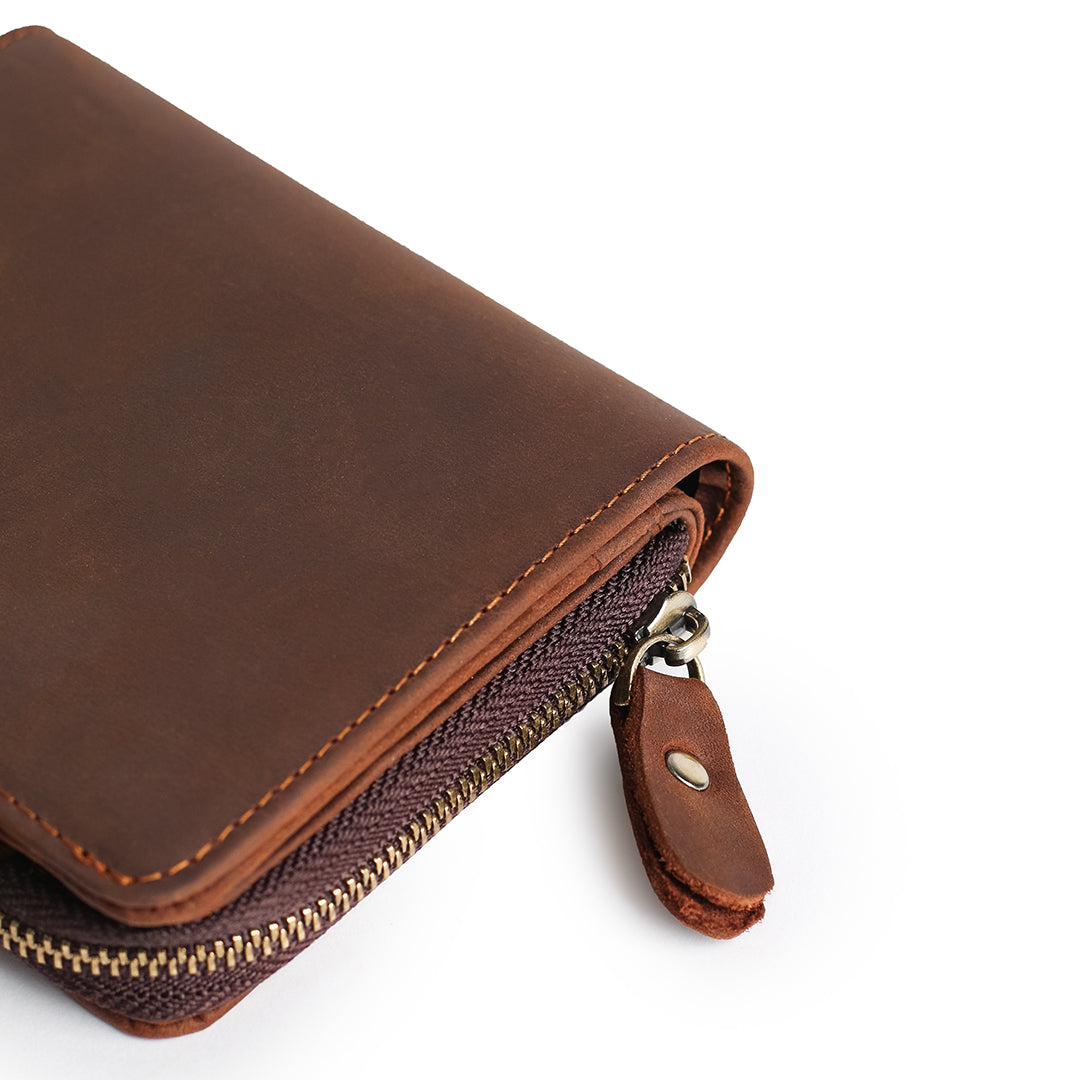 Brown leather wallet displayed with soft suede lining and transparent card slots for organized storage.