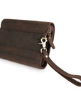 Back view of a dark brown leather wrist bag with an adjustable wrist strap, showcasing sturdy construction and design.