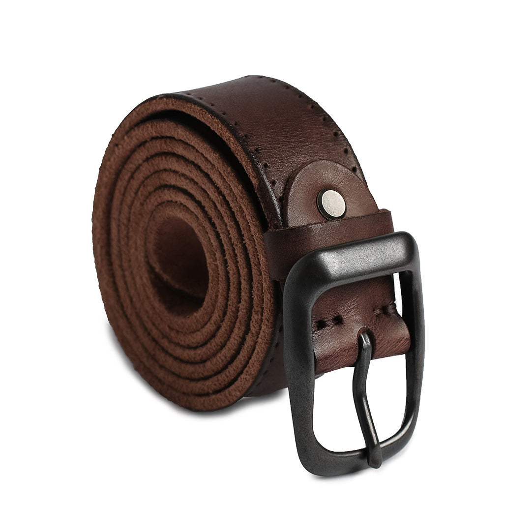 Brown leather belt neatly rolled to showcase its durable construction and vintage appeal with a matte buckle