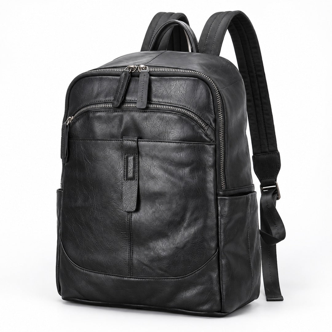 Black leather backpack with multiple zippered compartments and padded shoulder straps, shown on a plain white background.