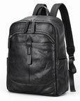 Black leather backpack with multiple zippered compartments and padded shoulder straps, shown on a plain white background.