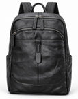 Black leather backpack with multiple zippered compartments, side pockets, and top handle, shown on a plain white background.