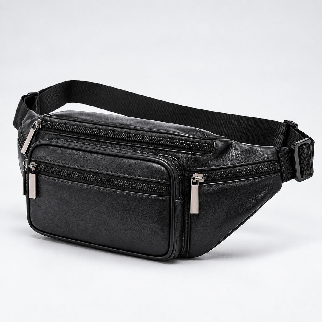 Black genuine leather fanny pack with multiple zippered compartments and an adjustable black webbing strap, shown on a light gray studio background.