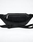 A black genuine leather waist bag with a zippered front pocket and an adjustable black webbing strap, shown against a plain white studio background.