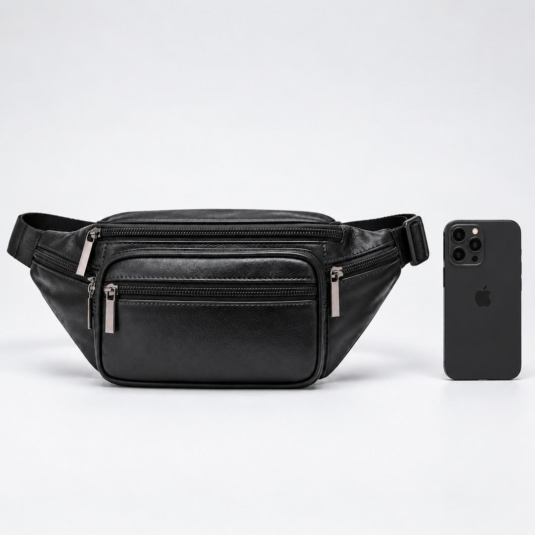 A black genuine leather fanny pack with multiple zippered compartments and silver-tone hardware, shown next to a black smartphone for scale on a light gray background.