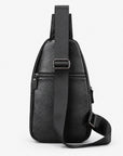 Black pebbled leather crossbody bag with a front zippered pocket and adjustable shoulder strap, shown on a light gray background.