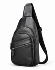Black pebbled leather sling bag with a front zippered pocket and adjustable shoulder strap, shown on a white background.