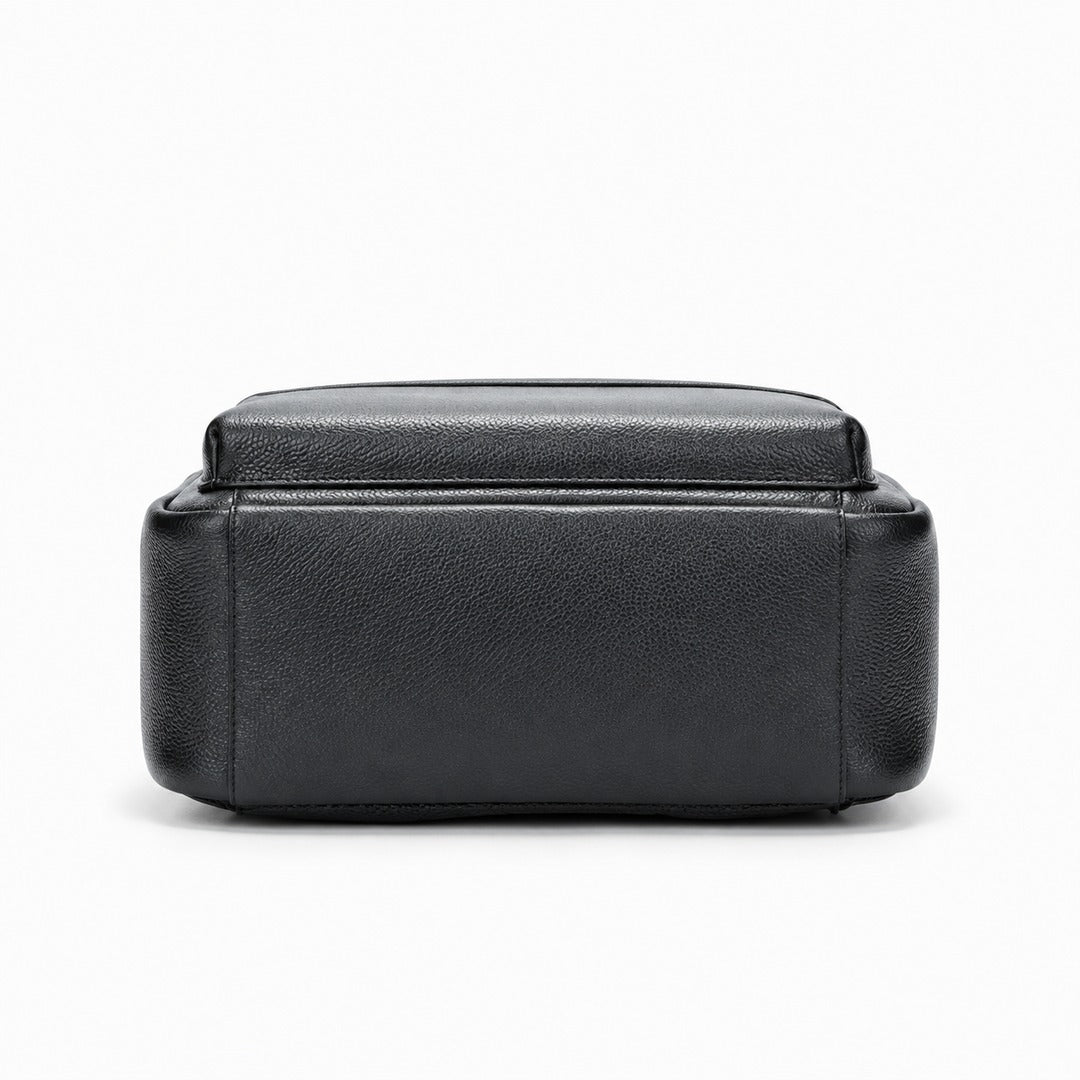 A black pebbled leather rectangular storage box or organizer with a hinged lid, shown from the front on a clean white background.