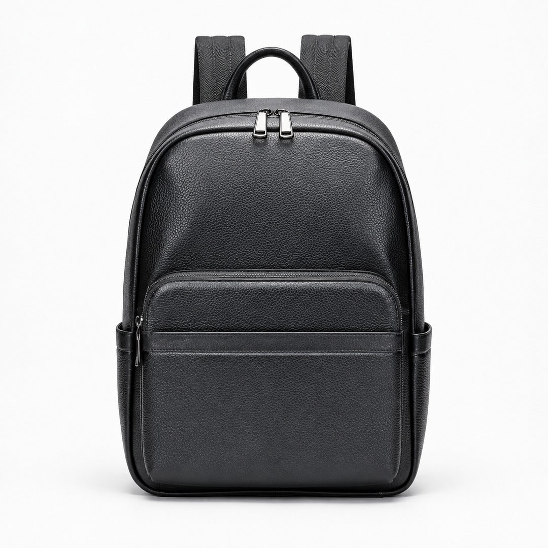 A black pebbled leather backpack with a top handle, dual zipper compartments, and side pockets, shown against a plain white background.